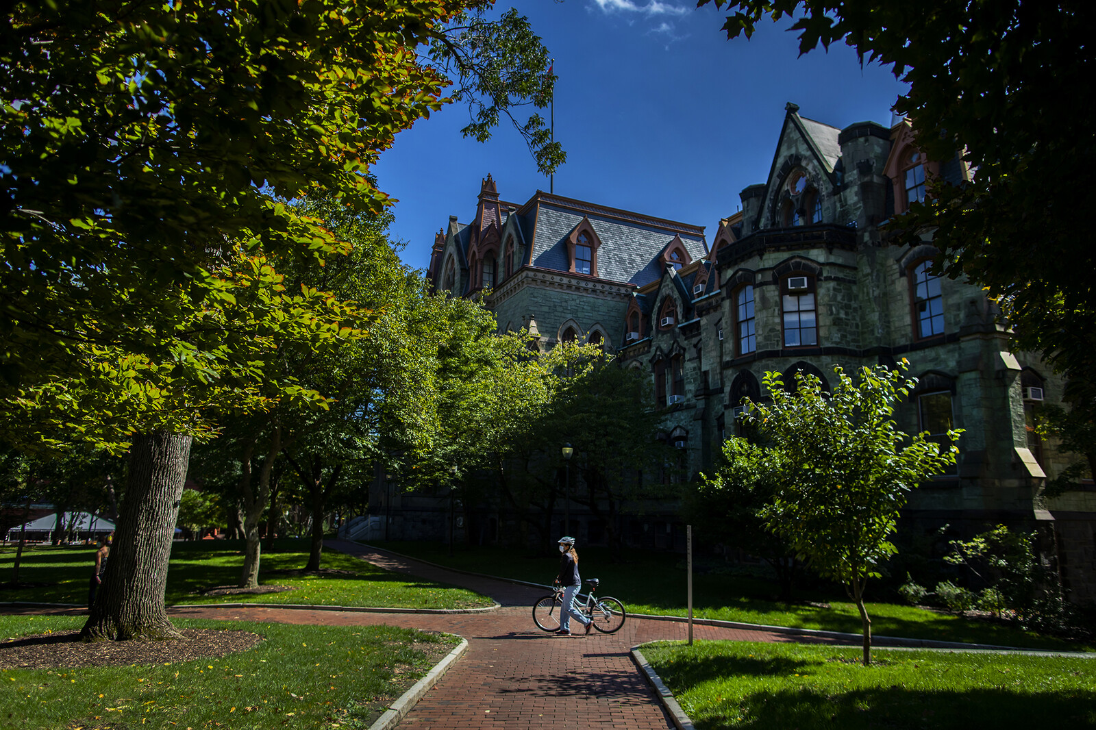 biker in front of college hall