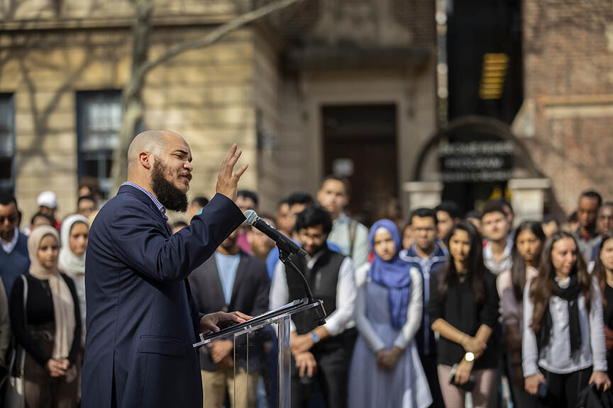 Rev. Charles Howard speaks to a diverse crowd of students on College Green